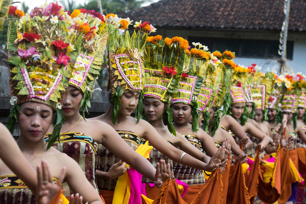 Dancers perform the sacred Rejang dance during Kuningan holiday, which marks the end of the 10-day Galungan festival celebrating the victory of good over evil, in Karangasem, Bali, Indonesia, Saturday, June 27, 2026. (AP Photo/Firdia Lisnawati)