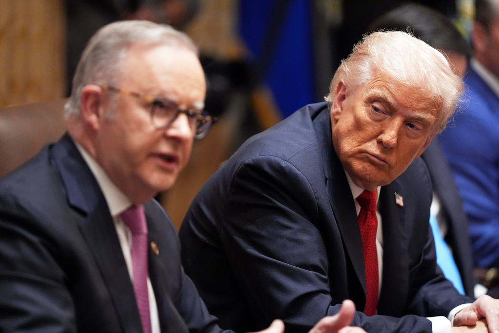 President Donald Trump, right, listens as Australian Prime Minister Anthony Albanese speaks in the Cabinet Room of the White House, Monday, October 20, 2025, in Washington. (AP Photo/Evan Vucci)