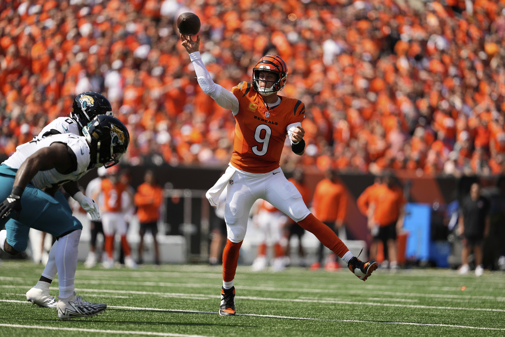 Cincinnati Bengals quarterback Joe Burrow (9) throws a pass during the first half of an NFL football game against the Jacksonville Jaguars, Sunday Sept. 14, 2025, in Cincinnati. (AP Photo/Carolyn Kaster)