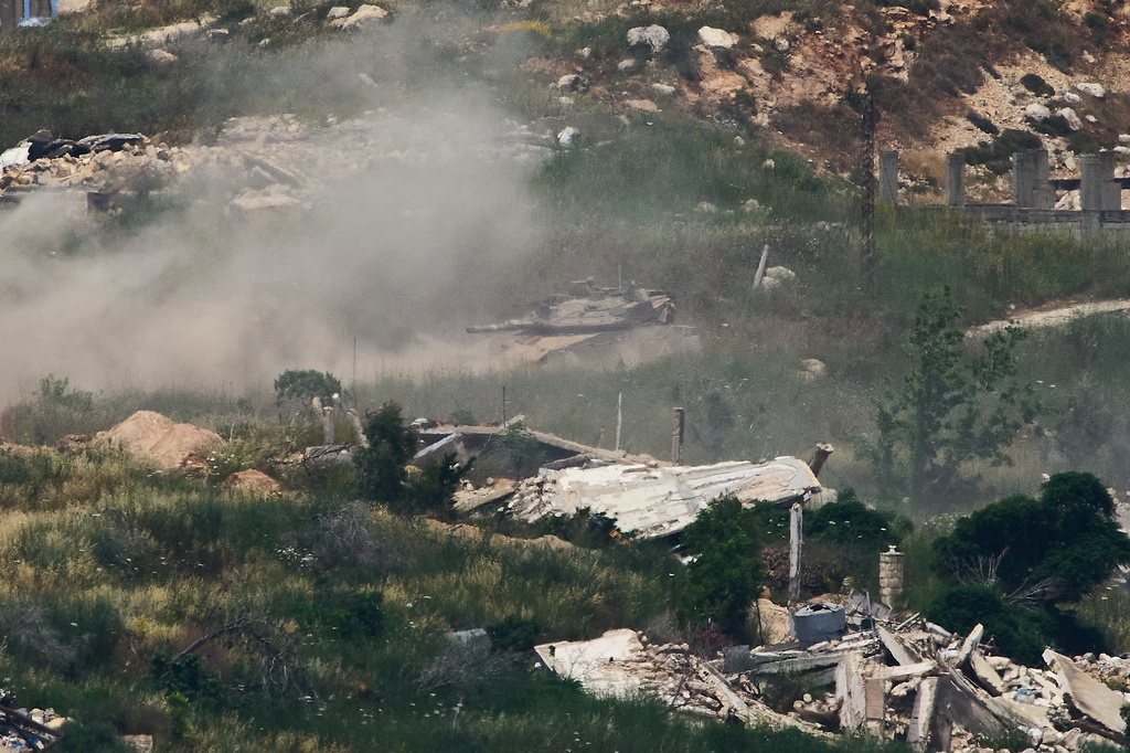 Israeli soldiers drive a tank in southern Lebanon as seen from northern Israel, Sunday, May 31, 2026. (AP Photo/Ariel Schalit)