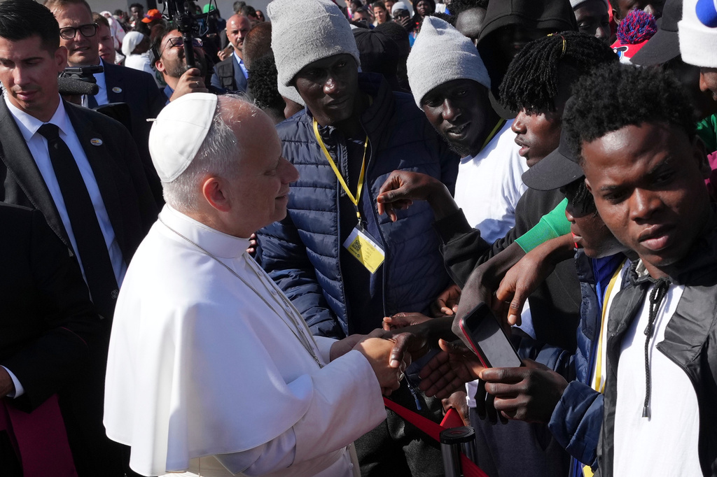 Pope Leo XIV meets migrants at the 'Las Raices' center, in San Cristobal de la Laguna, Tenerife, Spain, Friday, June 12, 2026. (AP Photo/Alessandra Tarantino)