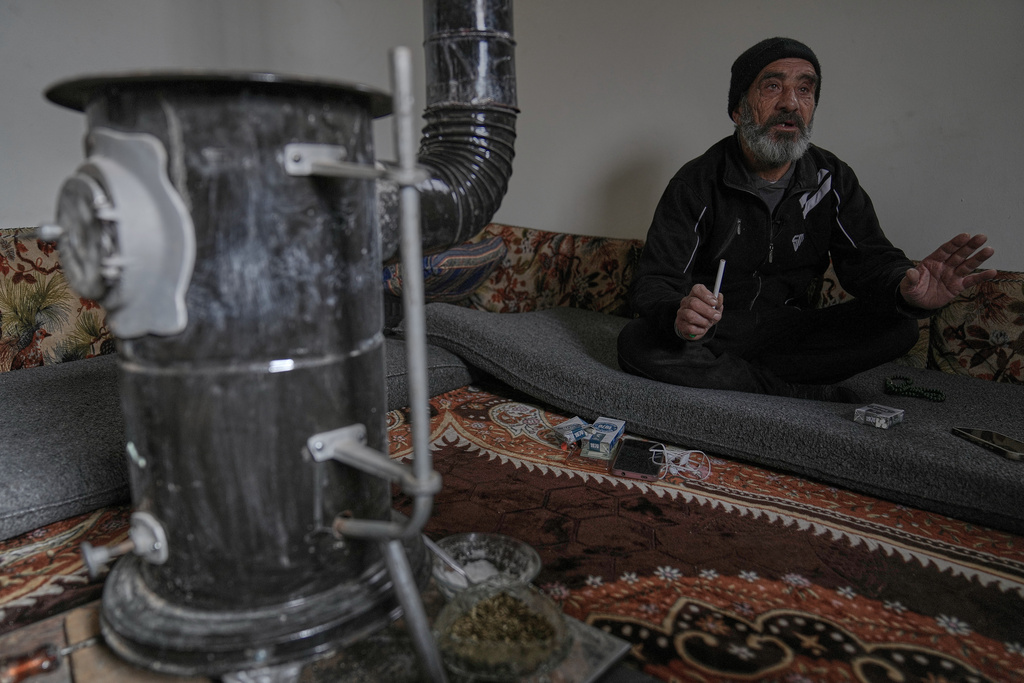 Mohammed Assoura, 57, a Syrian Shiite man sits in his housing unit at the Imam Ali Housing Compound, where hundreds of mostly Lebanese and Syrian Shiite Muslims displaced from Syria reside, in Hermel, northeast Lebanon, Jan. 30, 2026. 2026. (AP Photo/Hussein Malla)
