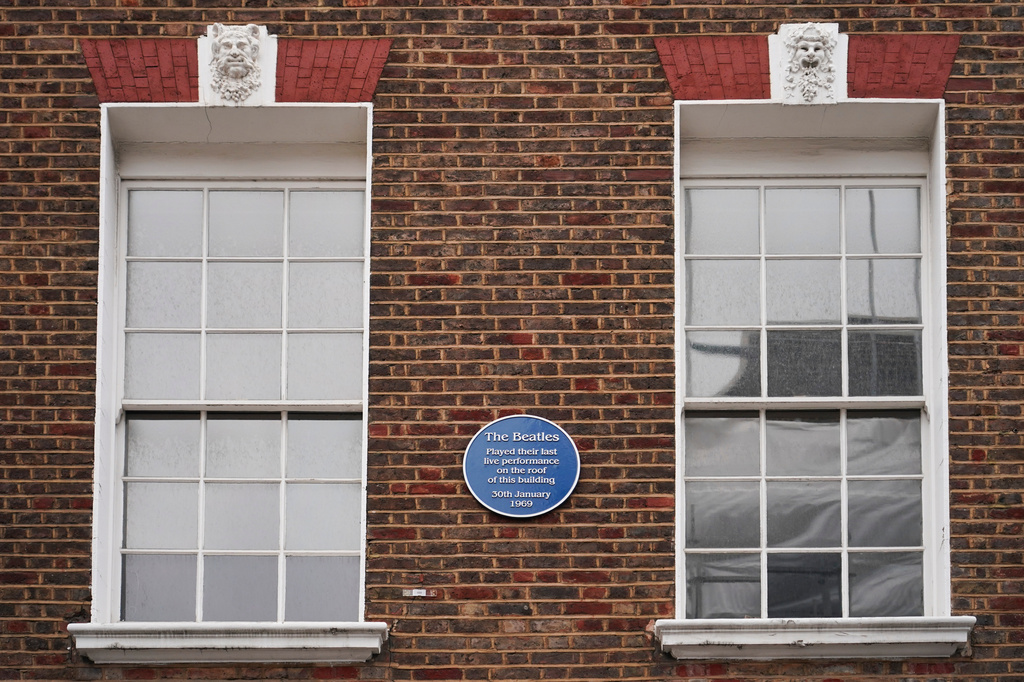 A view of the blue plaque on the building in Savile Row where The Beatles held their last ever concert as a band, which is due to be turned into a fan museum in 2027, in London, Sunday, May 10, 2026. (AP Photo/Alberto Pezzali)