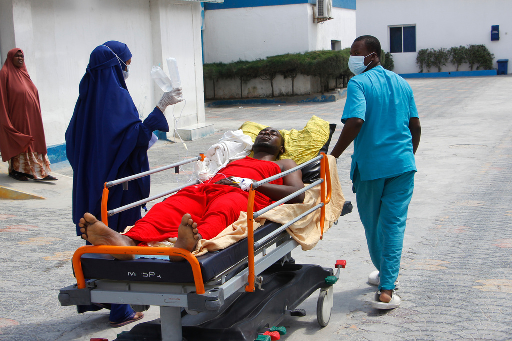 A patient receives treatment at a hospital after an hours-long militant attack in Mogadishu, Somalia, on Sunday, Oct. 5, 2025. (AP Photo/Farah Abdi Warsameh)