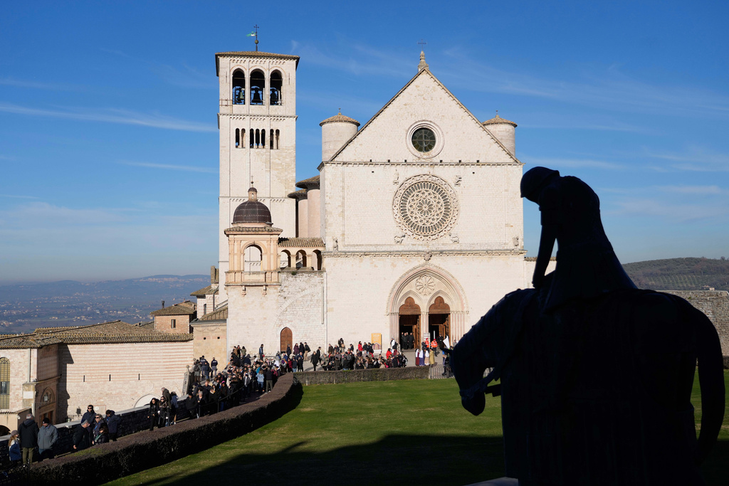 Pilgrims leave after they honored the bones of St. Francis during the first public display inside the St. Francis Basilica, marking the 800th anniversary of the saint's death, in Assisi, Italy, Sunday, Feb. 22, 2026.(AP Photo/Gregorio Borgia)