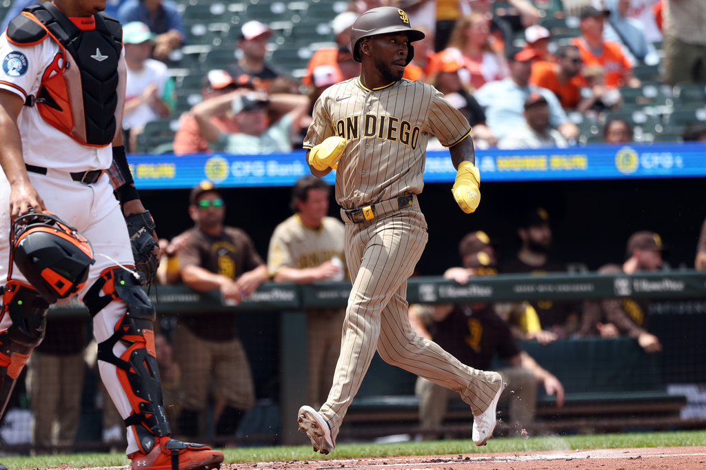 San Diego Padres' Samad Taylor scores during the second inning of a baseball game against the Baltimore Orioles, Sunday, June 14, 2026, in Baltimore. (AP Photo/Daniel Kucin Jr.)