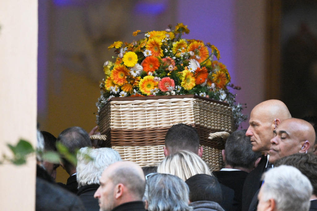 Actor Brigitte Bardot's coffin is carried into Notre-Dame de l'Assomption church for her funeral ceremony, Wednesday, Jan. 7, 2026 in Saint-Tropez, southern France. (AP Photo/Philippe Magoni)