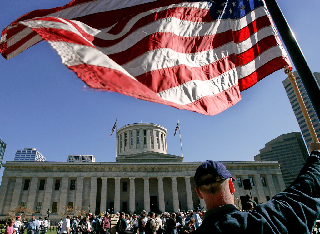 An American flag is outside the state capitol building in Columbus, Ohio, Oct. 25, 2004. (AP Photo/Laura Rauch, File)