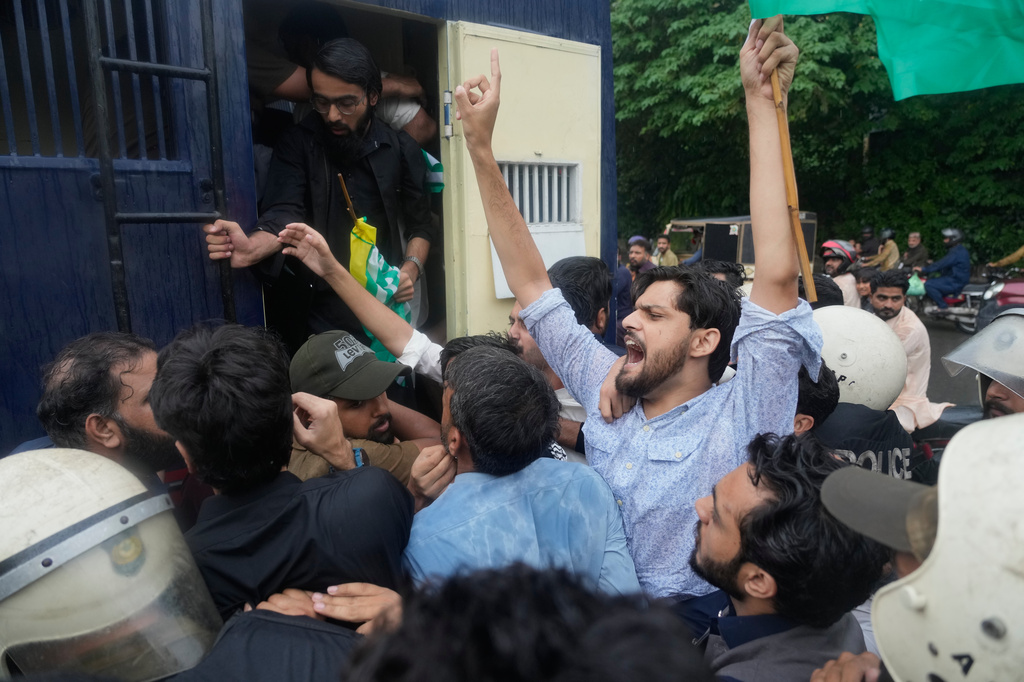 Police officers detain civil society activists during a demonstration in support of Kashmiri protesters in Lahore, Pakistan, Friday, July 31, 2026. (AP Photo/K.M. Chaudary)