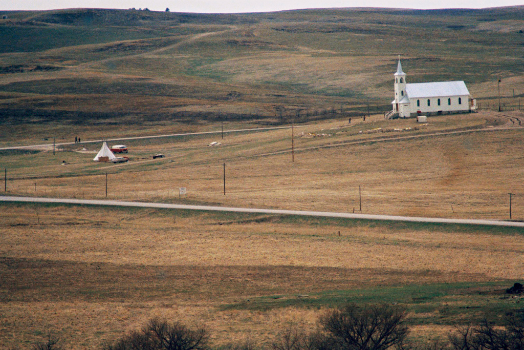 FILE - The Sacred Heart Catholic Church is seen, March 27, 1973, at the site of the Wounded Knee massacre, on the Pine Ridge Reservation in Wounded Knee, S.D. (AP Photo, File)
