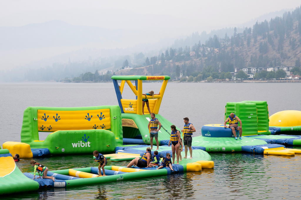 People play at the Peachland Water Park in Peachland, British Columbia, Canada, on Saturday, Aug. 8, 2026. (Gary Nylander/The Canadian Press via AP)