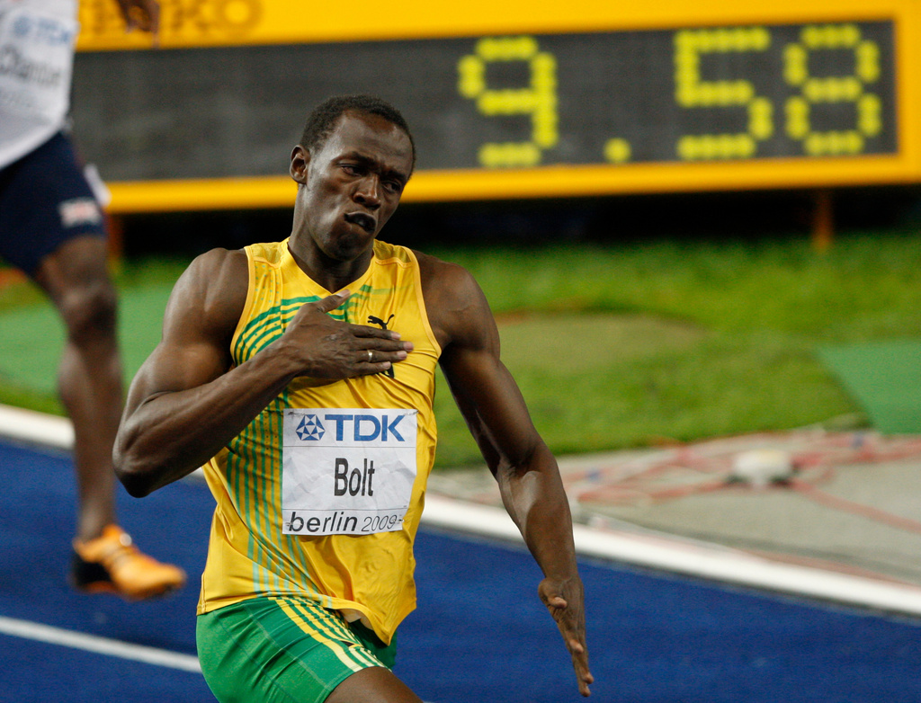 FILE - In this Aug. 16, 2009, file photo, Jamaica's Usain Bolt celebrates setting a new men's 100m world record at the World Athletics Championships in Berlin. (AP Photo/Michael Sohn, File)