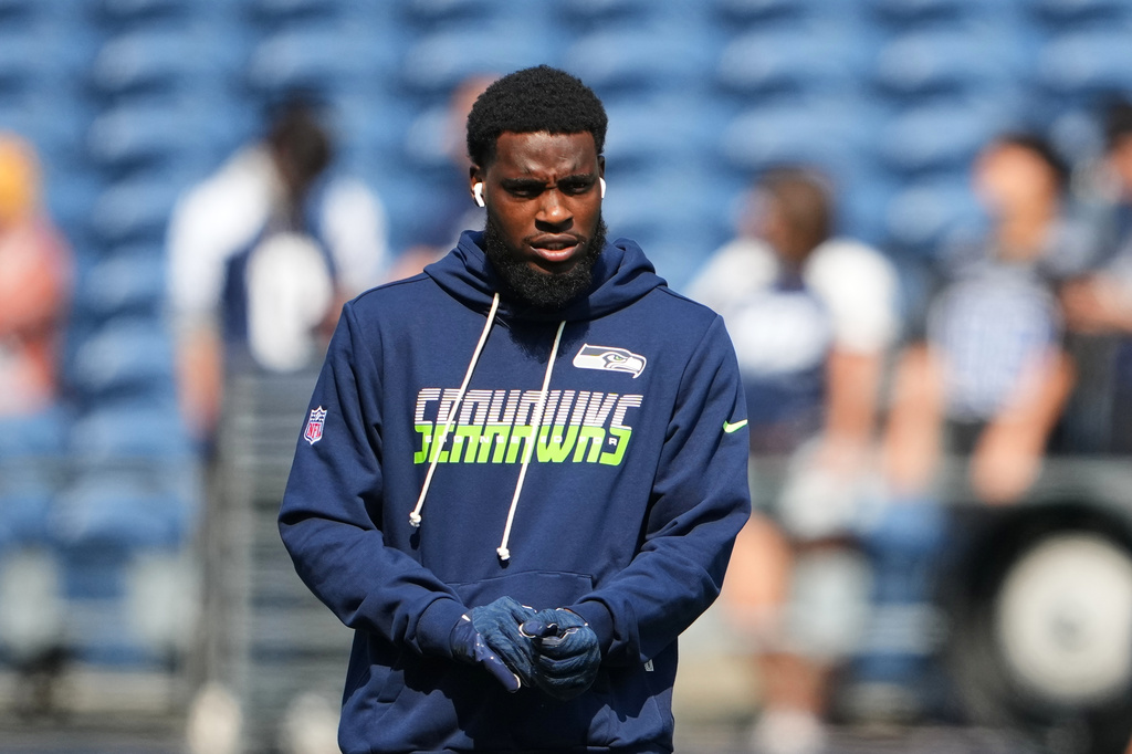 Seattle Seahawks cornerback Devon Witherspoon warms up before an NFL preseason football game against the Dallas Cowboys, Saturday, Aug. 15, 2026, in Seattle. (AP Photo/Lindsey Wasson)