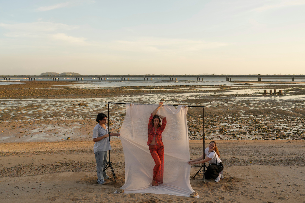 A model poses for an advertisement on the shore in the Casco Viejo, the historic district of Panama City, Wednesday, March 11, 2026. (AP Photo/Matias Delacroix)