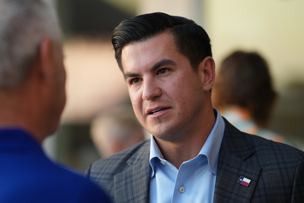 Republican candidate for congress Eric Flores visits with supporters during a campaign stop, in Corpus Christi, Texas, Wednesday, Feb. 11, 2026. (AP Photo/Eric Gay)