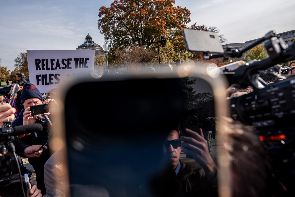 Reporters attempt to film Rep. Thomas Massie, R-Ky., following a news conference on the Epstein Files Transparency Act, Tuesday, Nov. 18, 2025, outside the U.S. Capitol in Washington. (AP Photo/Julia Demaree Nikhinson)