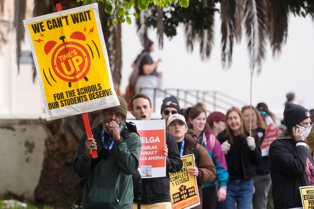 Teachers, students and supporters picket outside of Mission High School in San Francisco, Monday, Feb. 9, 2026. (AP Photo/Jeff Chiu)
