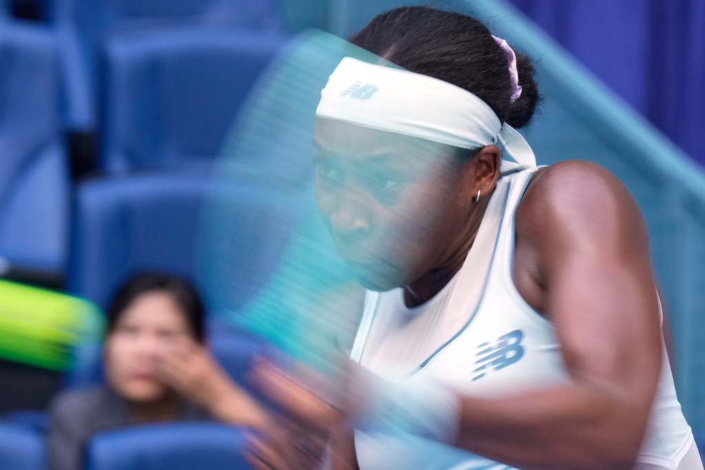 Coco Gauff of the United States plays a backhand return to Leylah Fernandez of Canada during the women's singles match for the China Open tennis tournament at the National Tennis Center in Beijing, China, Sunday, Sept. 28, 2025. (AP Photo/Mahesh Kumar A.)