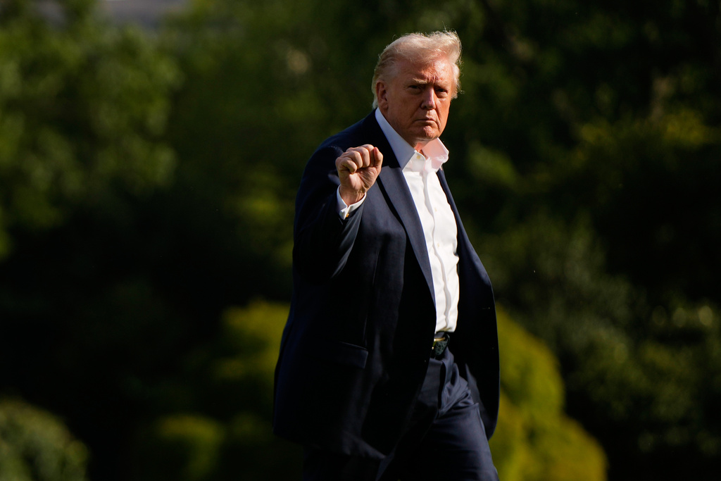 President Donald Trump gestures as he arrives at the White House, Friday, Sept. 26, 2025, in Washington. (AP Photo/Julia Demaree Nikhinson)