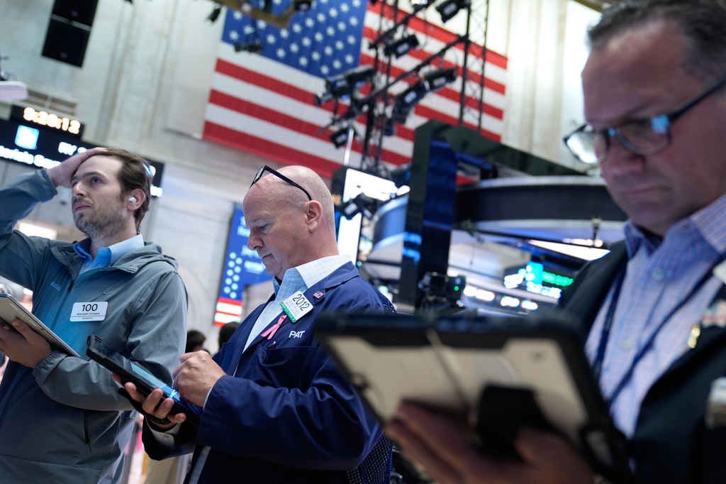 Traders work on the floor at the New York Stock Exchange in New York, Monday, July 6, 2026. (AP Photo/Seth Wenig)