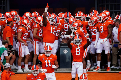 FILE - Clemson players touch Howard's Rock as they run onto the field for an NCAA college football game against Georgia Tech Saturday, Sept. 18, 2021, in Clemson, S.C. (AP Photo/John Bazemore, File) FILE - Clemson players touch Howard's Rock as they run onto the field for an NCAA college football game against Georgia Tech Saturday, Sept. 18, 2021, in Clemson, S.C. (AP Photo/John Bazemore, File)