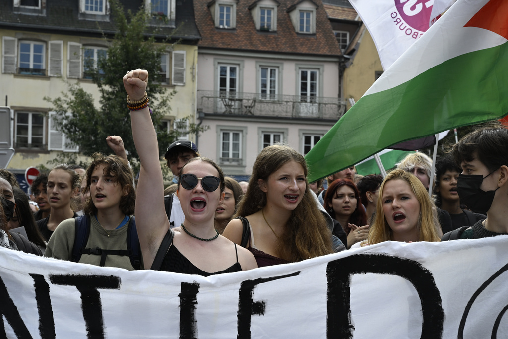 Protesters of the the "Block Everything" movement march during a rally in Strasbourg, eastern France, Wednesday, Sept. 10, 2025. (AP Photo/Pascal Bastien)