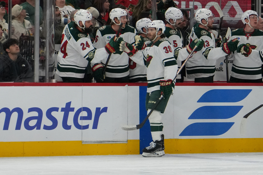 Minnesota Wild right wing Ryan Hartman (38) celebrates his goal against the Chicago Blackhawks during the first period of an NHL hockey game, Tuesday, March, 17, 2026, in Chicago. (AP Photo/David Banks)