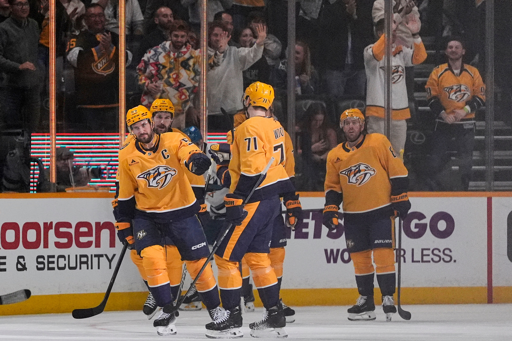 Nashville Predators defenseman Roman Josi, left, celebrates his goal with teammates during the first period of an NHL hockey game against the San Jose Sharks, Tuesday, March 24, 2026, in Nashville, Tenn. (AP Photo/George Walker IV)