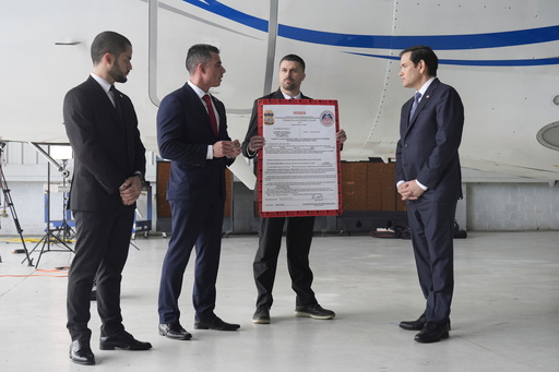 FILE - U.S. Secretary of State Marco Rubio, right, listens to Edwin F. Lopez, the attaché for DHS Homeland Security Investigations, second from left, next to the Venezuelan government airplane that Rubio announced is being seized by the U.S. during a news conference at La Isabela International Airport in Santo Domingo, Dominican Republic, Feb. 6, 2025. At left is Dominican Public Prosecutor Enmanuel Ramirez, and holding the "seized" sign is Robert Cunniff from the U.S. Department of Commerce. (AP Photo/Mark Schiefelbein, Pool, File) FILE - U.S. Secretary of State Marco Rubio, right, listens to Edwin F. Lopez, the attaché for DHS Homeland Security Investigations, second from left, next to the Venezuelan government airplane that Rubio announced is being seized by the U.S. during a news conference at La Isabela International Airport in Santo Domingo, Dominican Republic, Feb. 6, 2025. At left is Dominican Public Prosecutor Enmanuel Ramirez, and holding the "seized" sign is Robert Cunniff from the U.S. Department of Commerce. (AP Photo/Mark Schiefelbein, Pool, File)