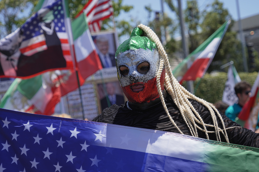 People protest outside Los Angeles Stadium before the World Cup Group G soccer match between Iran and New Zealand in Inglewood, Calif., near Los Angeles, Monday, June 15, 2026 (AP Photo/Ty ONeil)