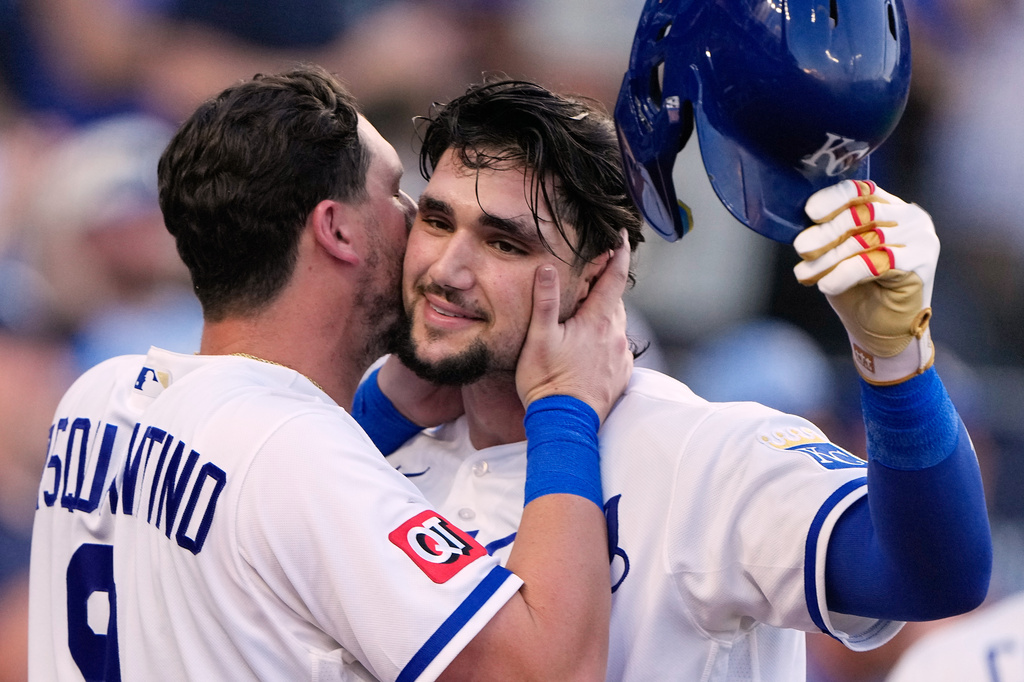 Kansas City Royals' Jac Caglianone, right, celebrates with Vinnie Pasquantino (9) after hitting a solo home run during the fifth inning of a baseball game against the Texas Rangers, Tuesday, June 9, 2026, in Kansas City, Mo. (AP Photo/Charlie Riedel)
