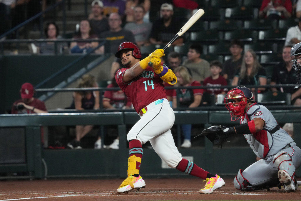 Arizona Diamondbacks' Gabriel Moreno (14) hits against the Washington Nationals in the first inning of a baseball game, Sunday, June 7, 2026, in Phoenix. (AP Photo/Rick Scuteri)