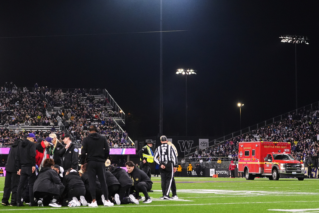An ambulance enters the field to take Washington wide receiver Raiden Vines-Bright away after he sustained an injury against Purdue during the first half of an NCAA college football game, Saturday, Nov. 15, 2025, in Seattle. (AP Photo/Lindsey Wasson)