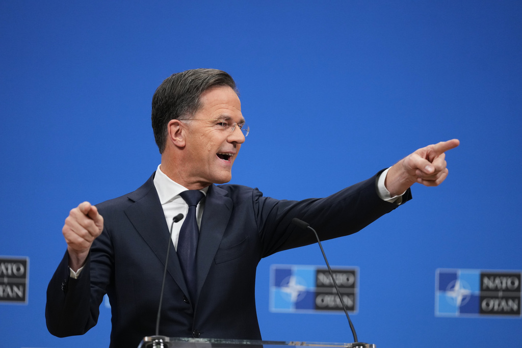 NATO Secretary General Mark Rutte takes questions from journalists during a pre-ministerial media conference at NATO headquarters in Brussels, Tuesday, Dec. 2, 2025. (AP Photo/Virginia Mayo)