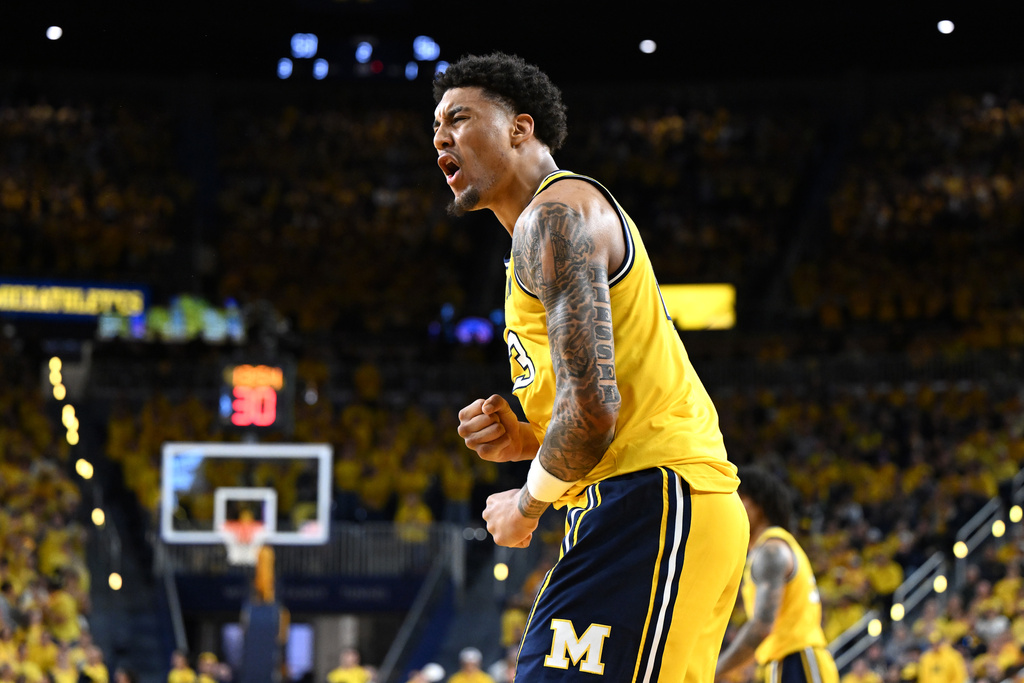 Michigan forward Yaxel Lendeborg celebrates after dunking the ball against Michigan State in the second half of an NCAA college basketball game in Ann Arbor, Mich., Sunday, March 8, 2026. (AP Photo/Lon Horwedel)