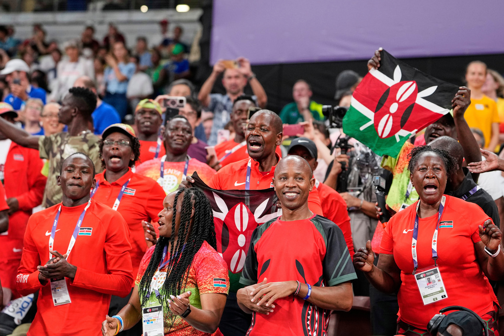 FILE - Kenyan fans react after the women's 5,000 meters final at the World Athletics Championships in Tokyo, Saturday, Sept. 20, 2025. (AP Photo/Eugene Hoshiko, file)