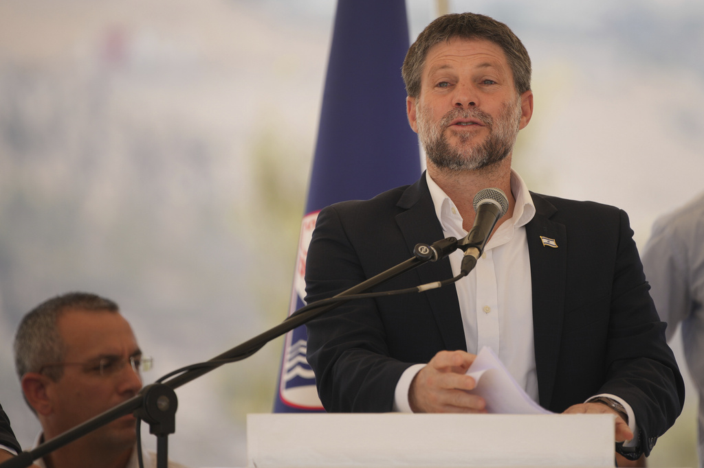 CORRECTS DAY Israeli Finance Minister Bezalel Smotrich speaks to journalists during a press conference about new settlement construction in the Israel-occupied West Bank near Maale Adumim, Thursday, Aug. 14, 2025. (AP Photo/Ohad Zwigenberg)