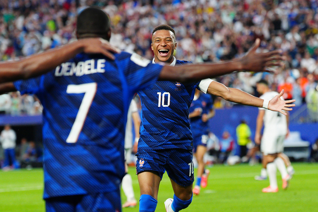 France's Ousmane Dembele (7) celebrates with Kylian Mbappe (10) after scoring their third goal during the World Cup Group I soccer match between France and Iraq in Philadelphia, Monday, June 22, 2026. (AP Photo/Derik Hamilton)