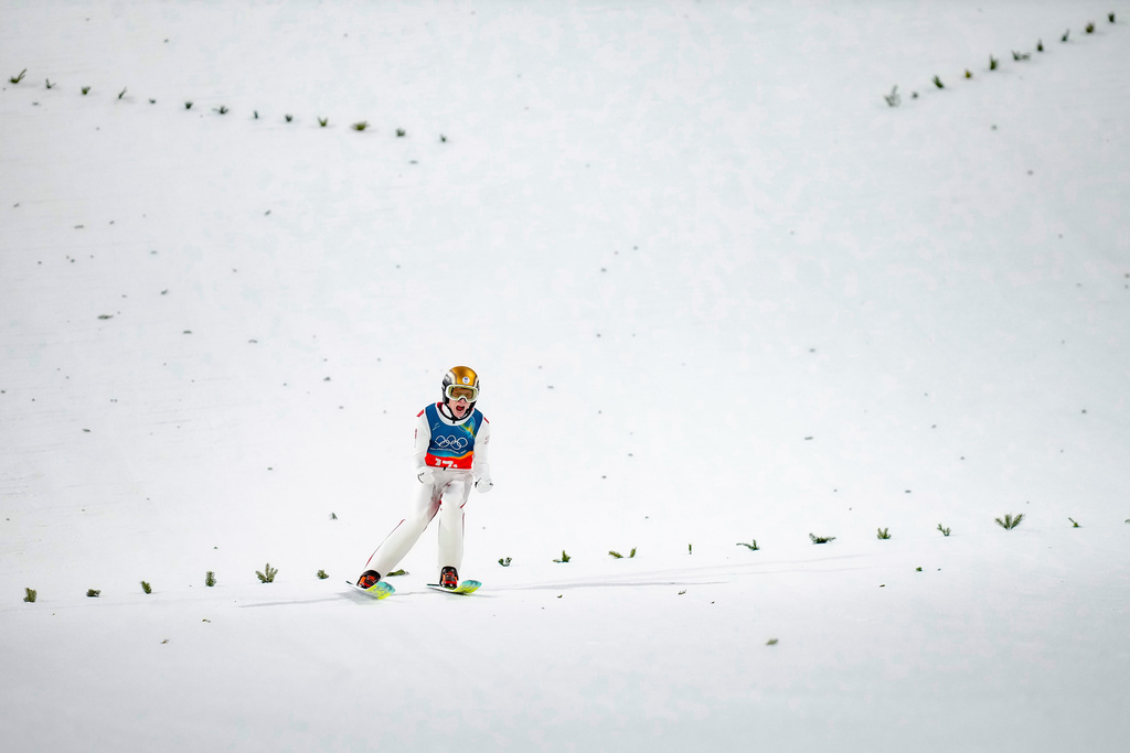 Jan Hoerl, of Austria, reacts after his final round jump of the ski jumping men's super team competition at the 2026 Winter Olympics, in Predazzo, Italy, Monday, Feb. 16, 2026. (AP Photo/Evgeniy Maloletka)