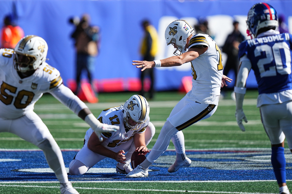 New Orleans Saints kicker Daniel Carlson (10) kicks a field goal during the first half of an NFL football game against the New York Giants in East Rutherford, N.J., Sunday, Oct. 18, 2026. (AP Photo/Frank Franklin II)