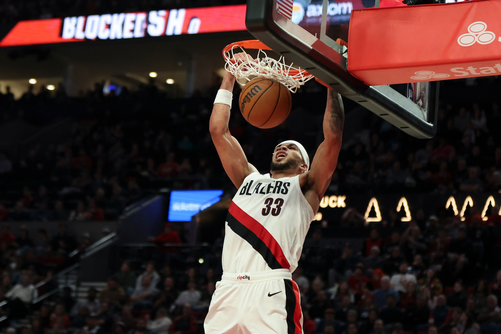Portland Trail Blazers forward Toumani Camara dunks against the Philadelphia 76ers during the second half of an NBA basketball game, Monday, Feb. 9, 2026, in Portland, Ore. (AP Photo/Amanda Loman)