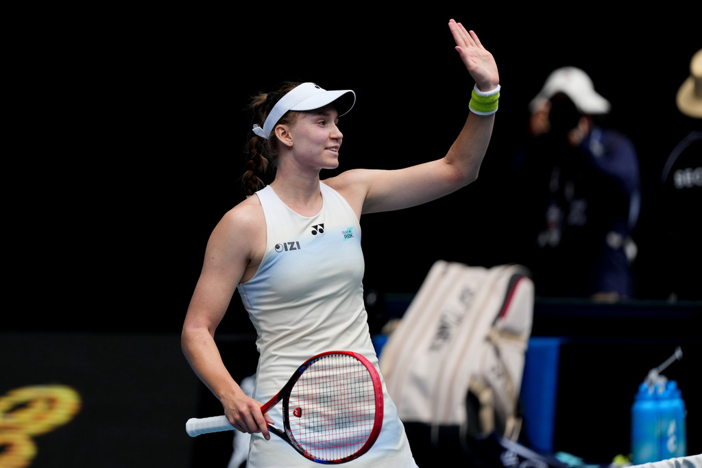 Elena Rybakina of Kazakhstan waves after defeating Iga Swiatek of Poland in their quarterfinal match at the Australian Open tennis championship in Melbourne, Australia, Wednesday, Jan. 28, 2026. (AP Photo/Dar Yasin)