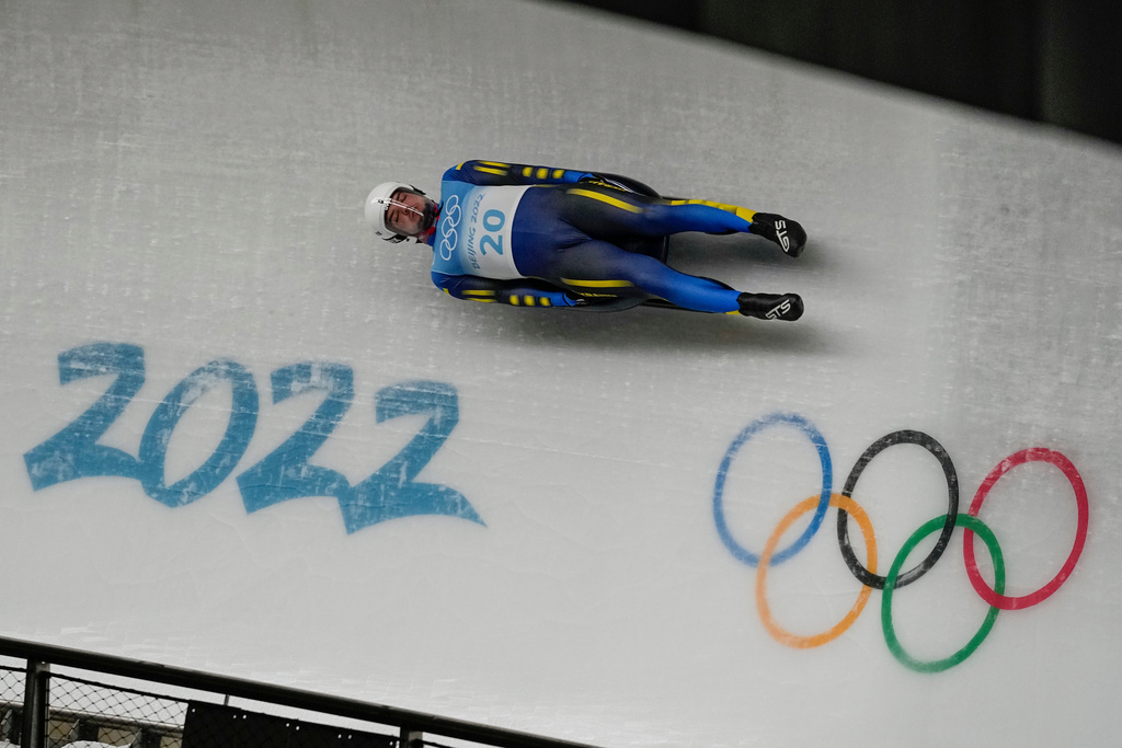 FILE -Anton Dukach, of Ukraine, slides during the luge men's single round 3 at the 2022 Winter Olympics, Feb. 6, 2022, in the Yanqing district of Beijing. (AP Photo/Pavel Golovkin, File)