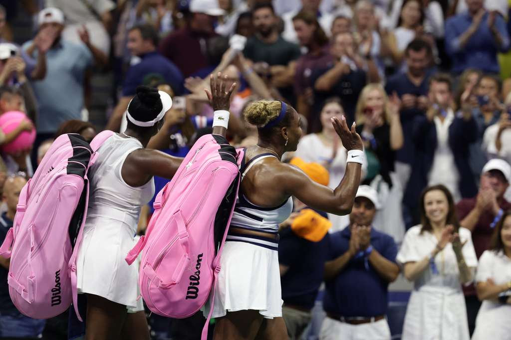 Venus, left, and Serena Williams, of the United States, acknowledge the fans after losing a women's doubles match against Hao-Ching Chan, of Taiwan, and Maya Joint, at the U.S. Open tennis championships, Friday, Sept. 4, 2026, in New York. (AP Photo/Adam Hunger)