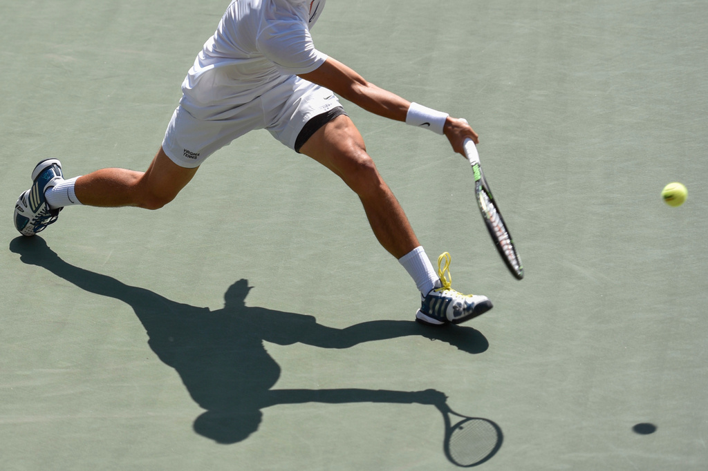 FILE - A player swings his racket in the final match of the NCAA men's tennis championship on May, 29, 2017, in Athens, Ga. (AP Photo/Richard Hamm, File)