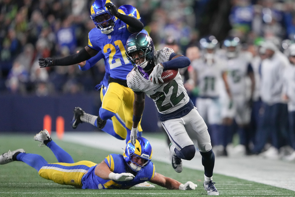 Seattle Seahawks wide receiver Rashid Shaheed (22) runs for a touchdown during the second half of an NFL football game against the Los Angeles Rams, Thursday, Dec. 18, 2025, in Seattle. (AP Photo/Lindsey Wasson)