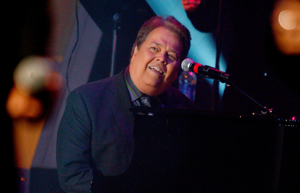 FILE - Alan Osmond performs during a taping of the Osmonds 50th anniversary show in Las Vegas on Aug. 14, 2007. (AP Photo/Isaac Brekken, File)