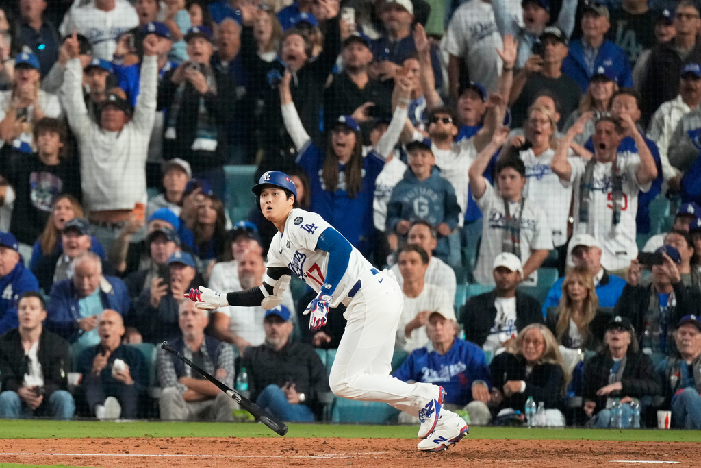 Los Angeles Dodgers' Shohei Ohtani watches his RBI-Double against the Toronto Blue Jays during the fifth inning in Game 3 of baseball's World Series, Oct. 27, 2025, in Los Angeles. (AP Photo/Mark J. Terrill, File)