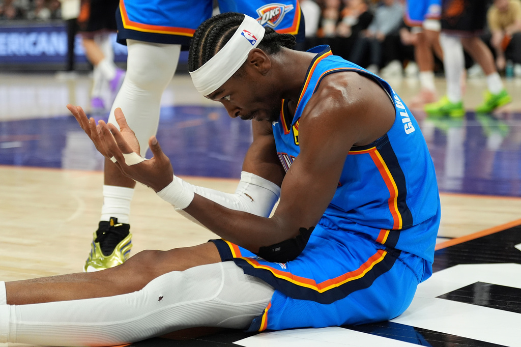 Oklahoma City Thunder guard Shai Gilgeous-Alexander celebrates a scores against the Phoenix Suns during the second half of Game 4 in a first-round NBA playoffs basketball series, Monday, April 27, 2026, in Phoenix. (AP Photo/Ross D. Franklin)