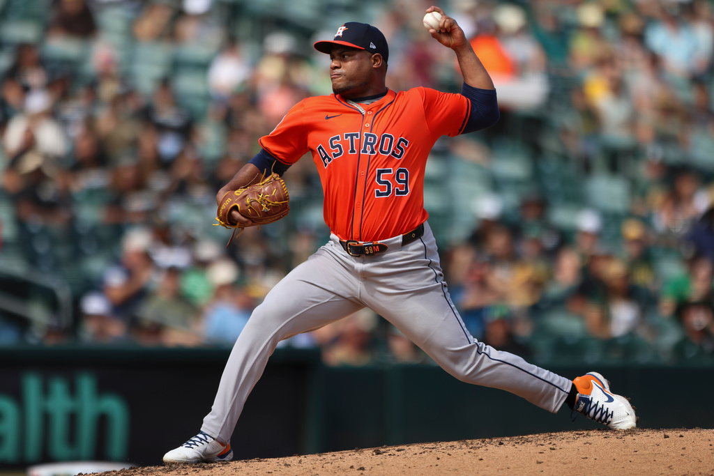 FILE - Houston Astros pitcher Framber Valdez throws to an Athletics batter during the third inning of a baseball game Sept. 25, 2025, in West Sacramento, Calif. (AP Photo/Scott Marshall, File)